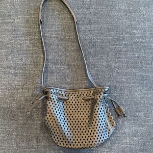 Anthropologie black Perforated bucket Crossbody Bag